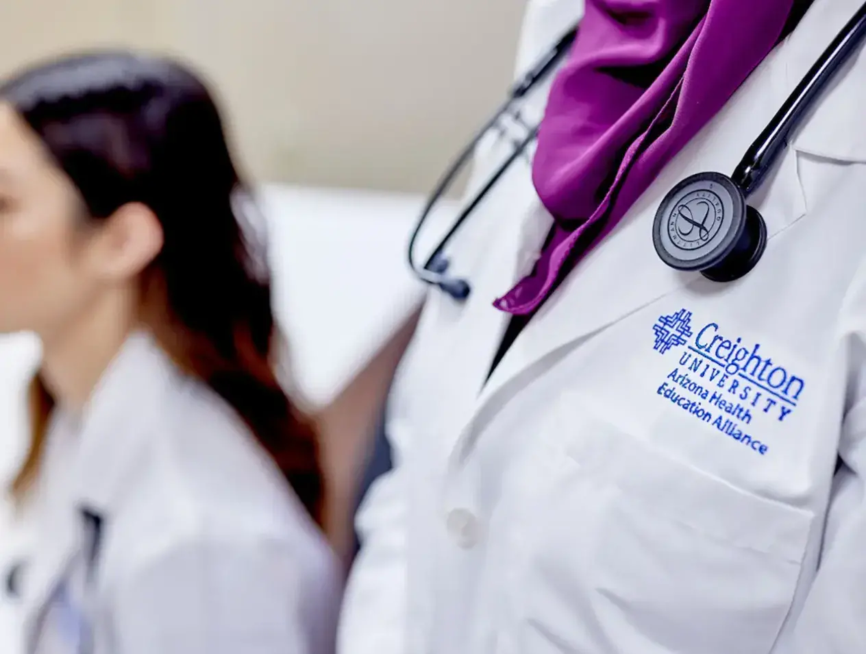 Creighton logo on white coat