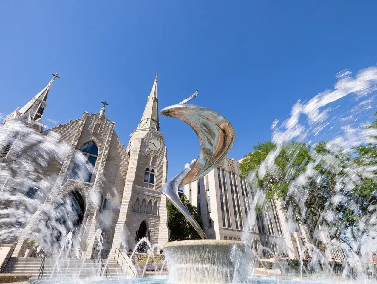 Fountain with flame statue outside St. John's church.