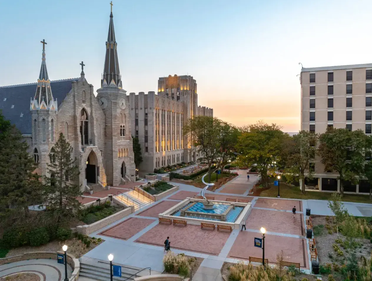 Morning wide shot of Creighton mall and fountain outside St. John's church.