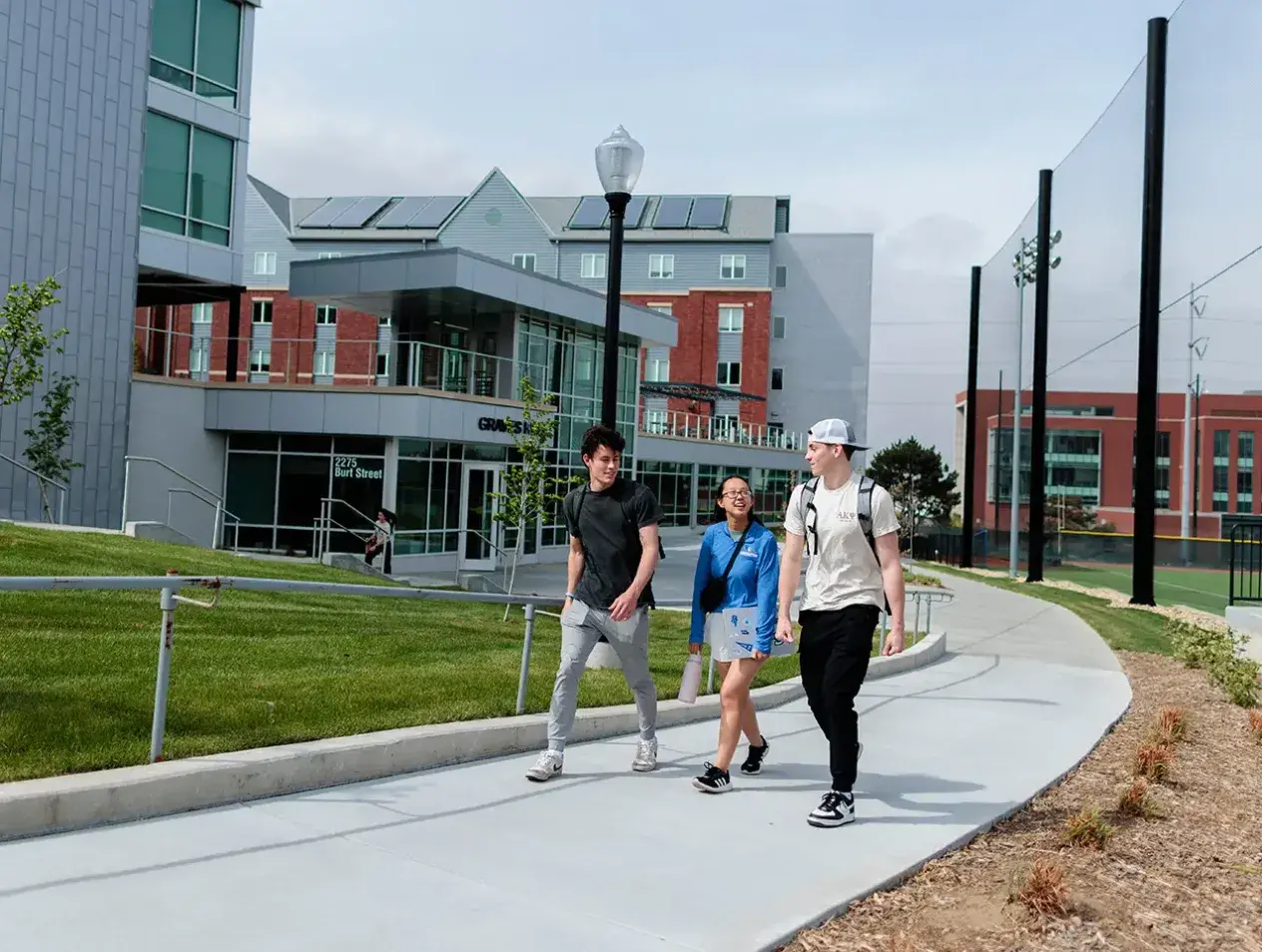 Students walking by residence hall
