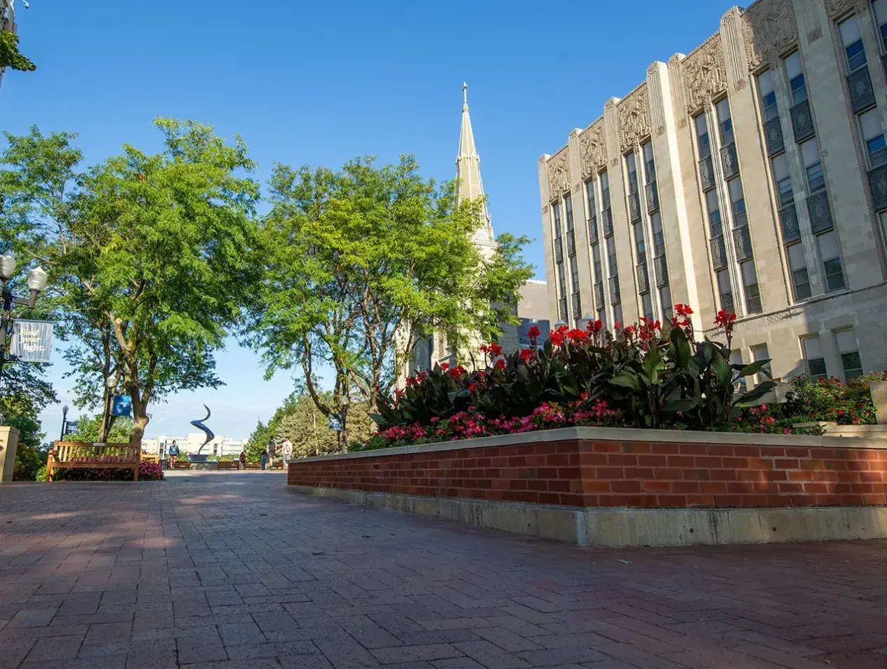 Campus mall with flower bed.