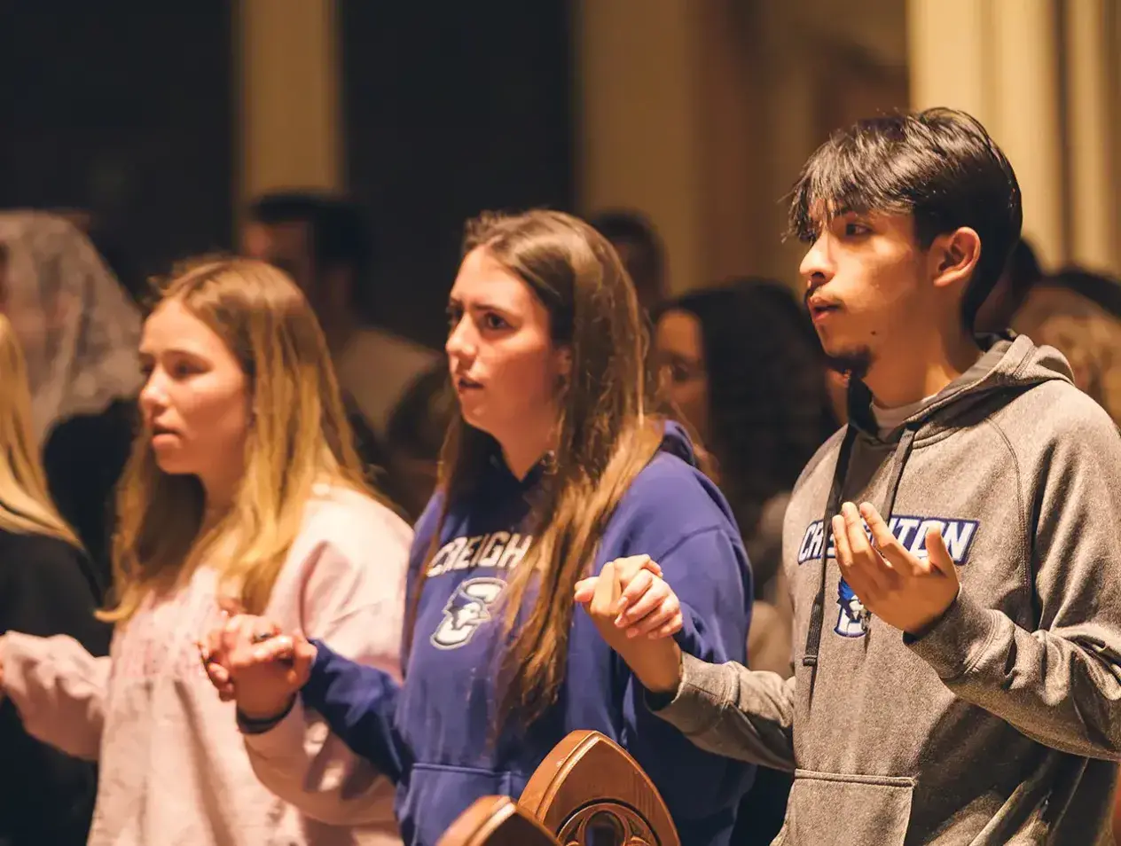 Students worshipping together in church.