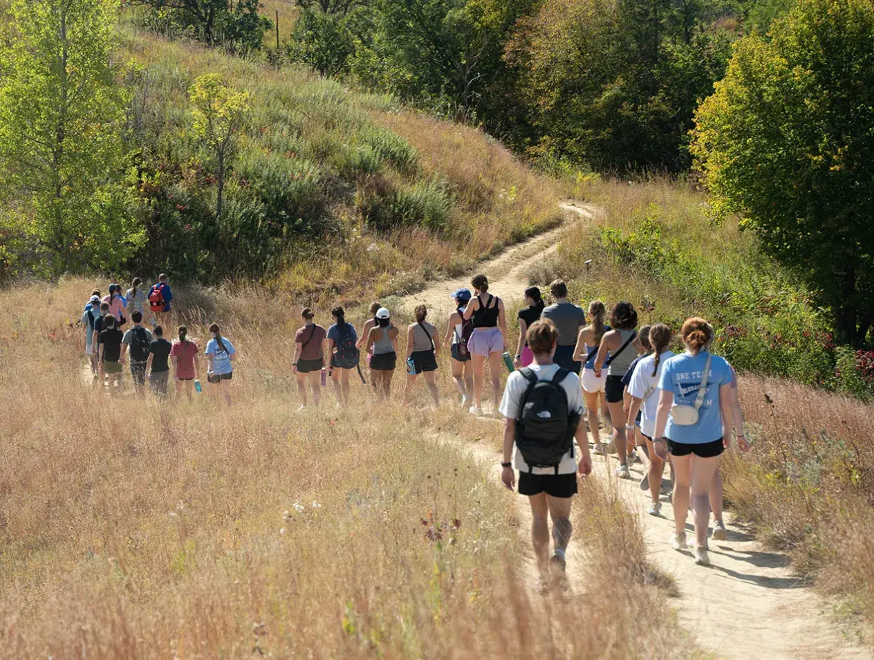 Students walking on trail.