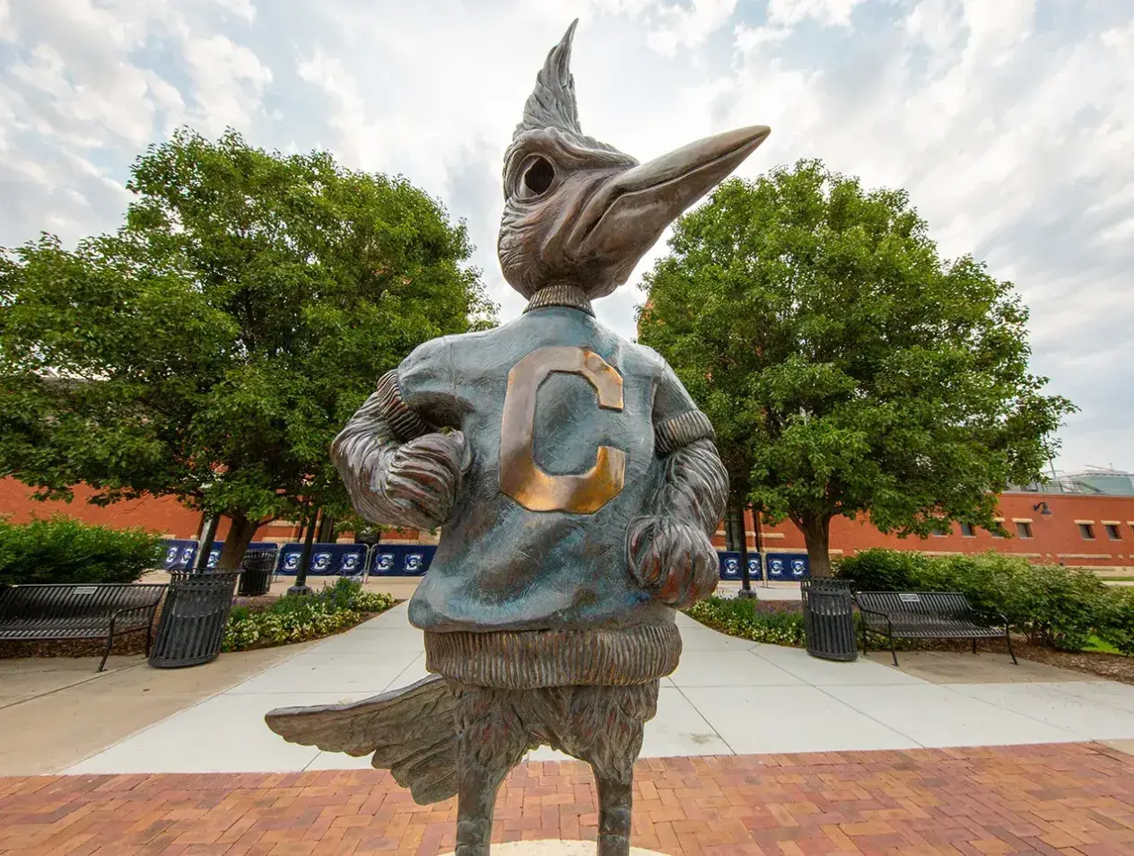 Billy Bluejay statue on cloudy day.