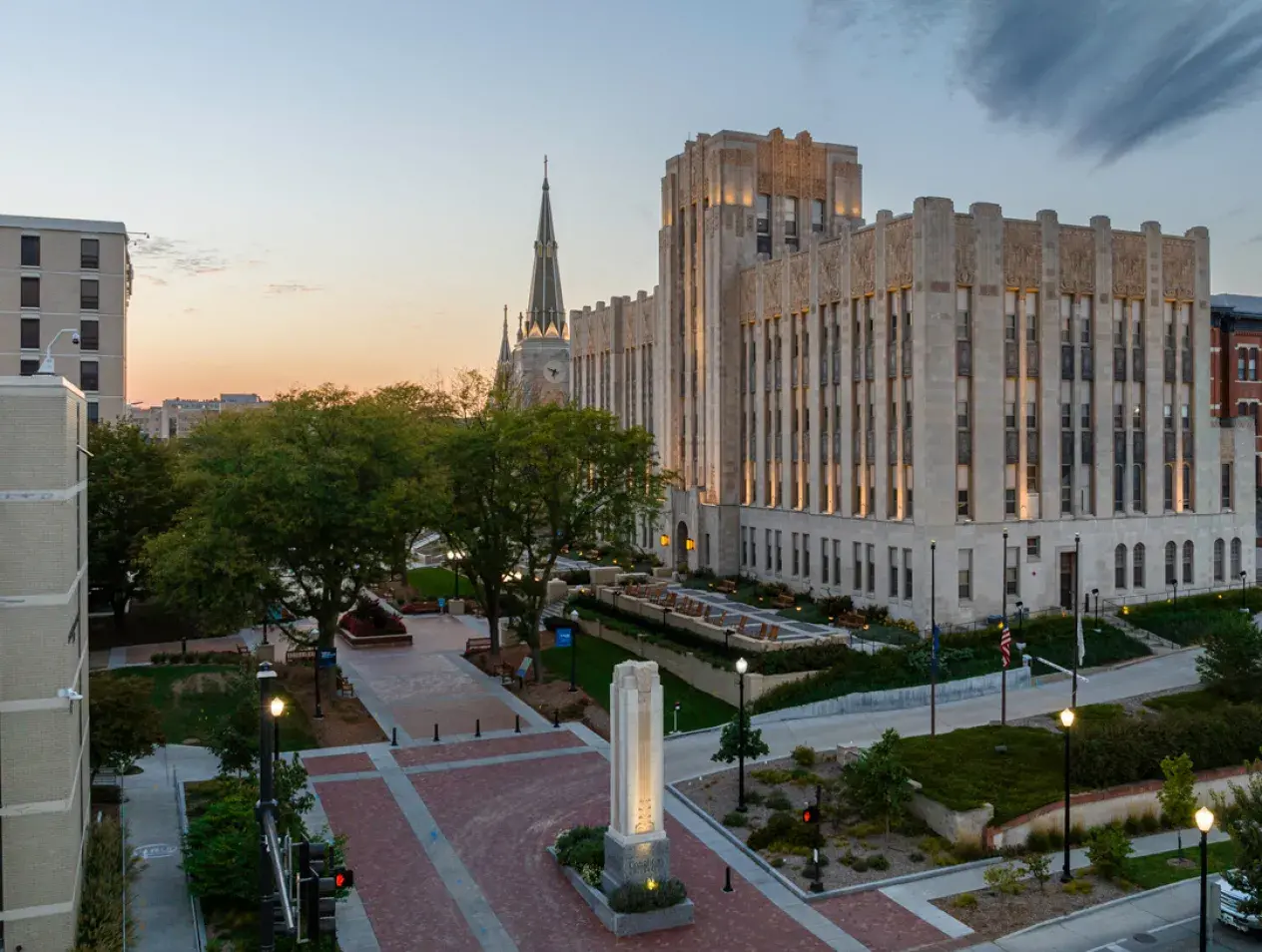 Drone image of Creighton Hall and the Creighton walking mall looking west into the sunset