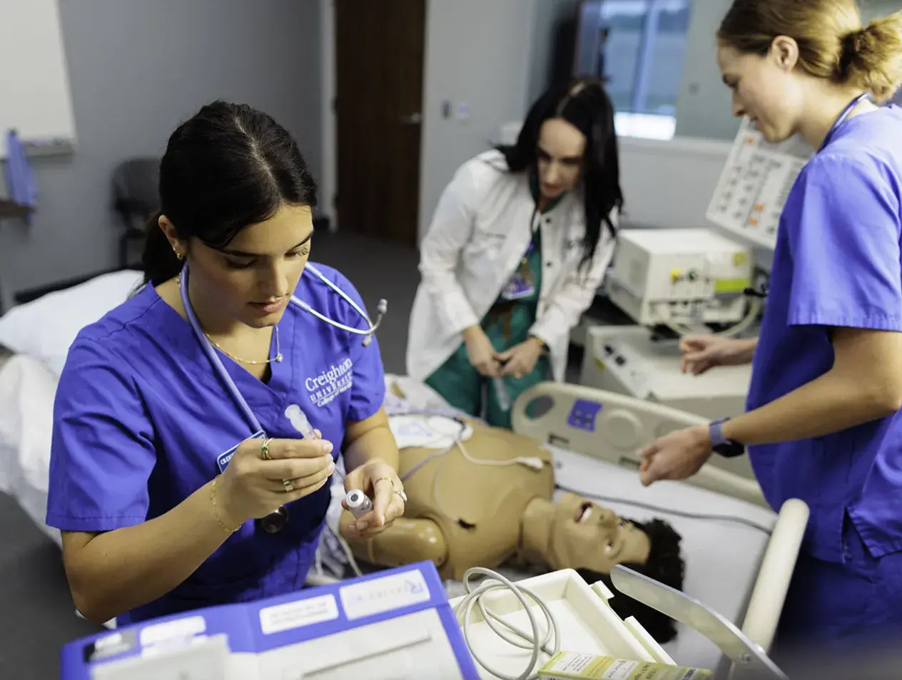 nursing students practicing in lab