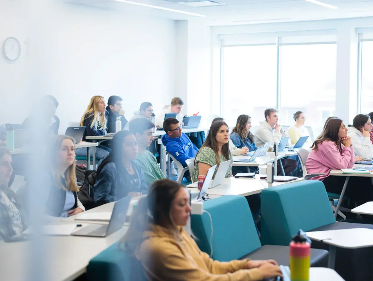 Students in a classroom listening to a lecture