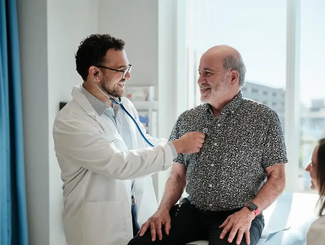 Doctor treating patient during exam
