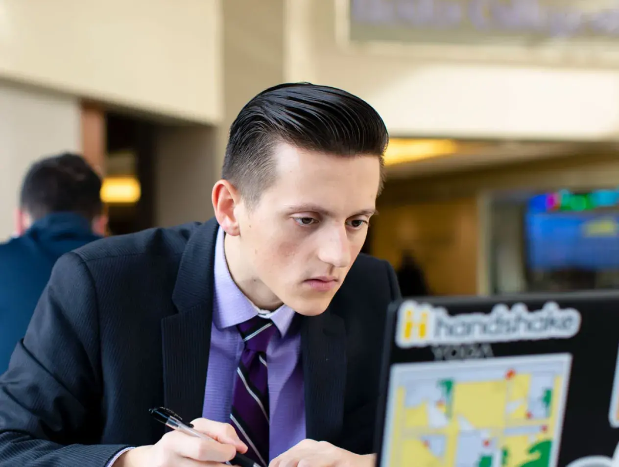 Student looking at laptop