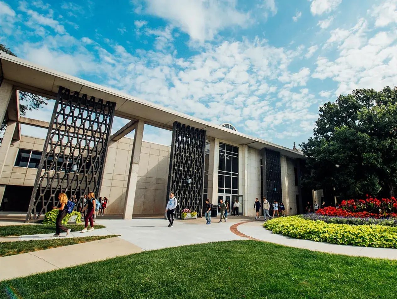 students walking in front of Reinert Alumni Library