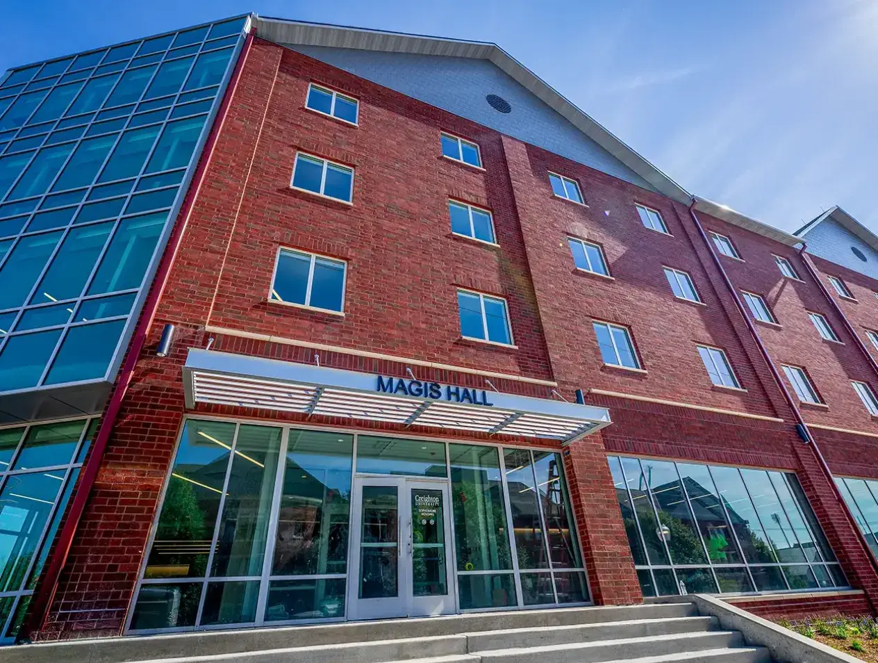 Magis Hall front exterior on sunny day.