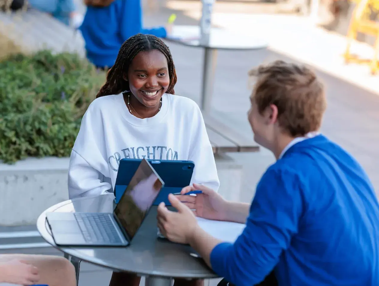 Creighton students studying outside