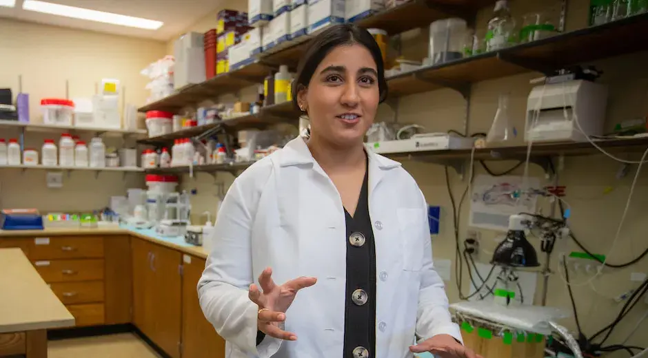 Huda Mian talks in lab setting talking about her research accomplishments.