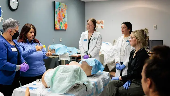 Nuring students and instructor in practial lab