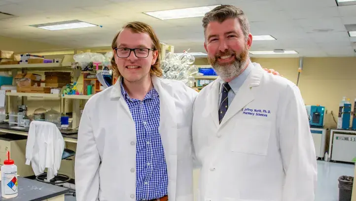 Daniel Kohl with Jeffrey North in lab setting.