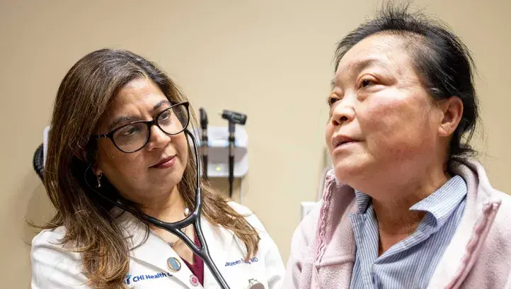 Naureen Rafiq, MD, with a patient