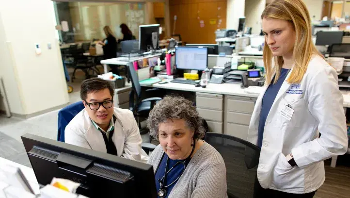 healt professionals at computer in office