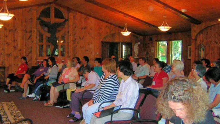 People in worship communion at St. Kateri