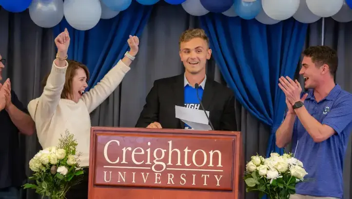 Match recipient celebrating at podium.
