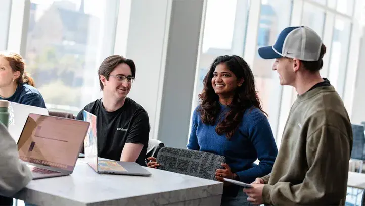 students socializing at a table