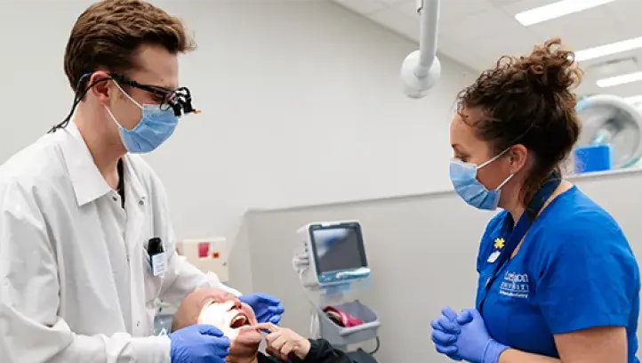 Dental student working in clinic