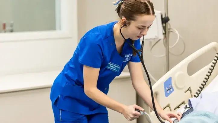 Rachel Malander at work in hospital room.
