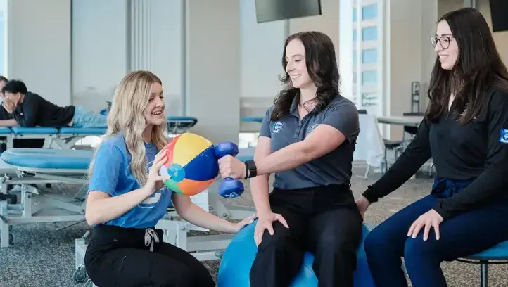 Occupational therapist working with to train students.