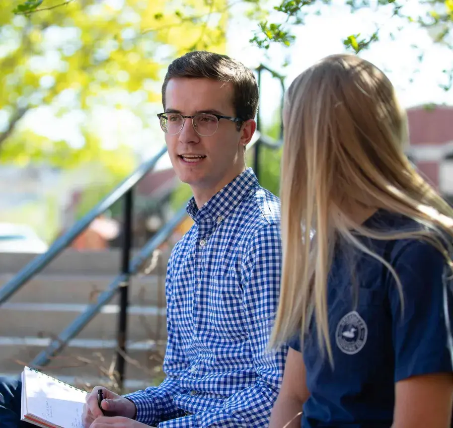 Students in discussion outdoors