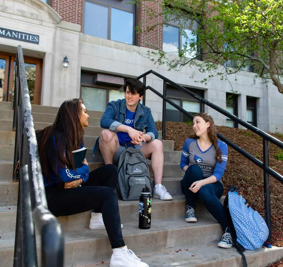 Students gathering outdoors on Creighton campus