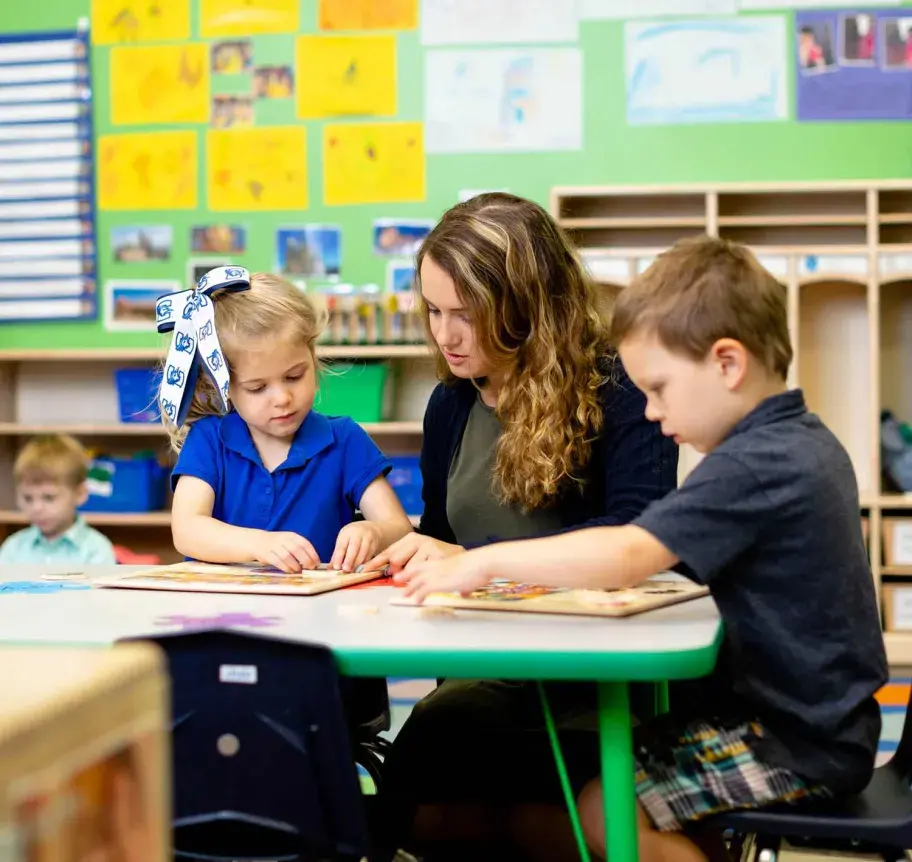 Teacher with elementary students in classroom