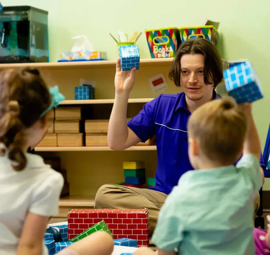 Teacher interacting with elementary students
