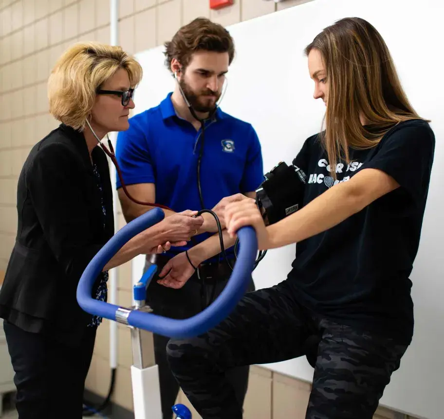 Faculty and student in gym