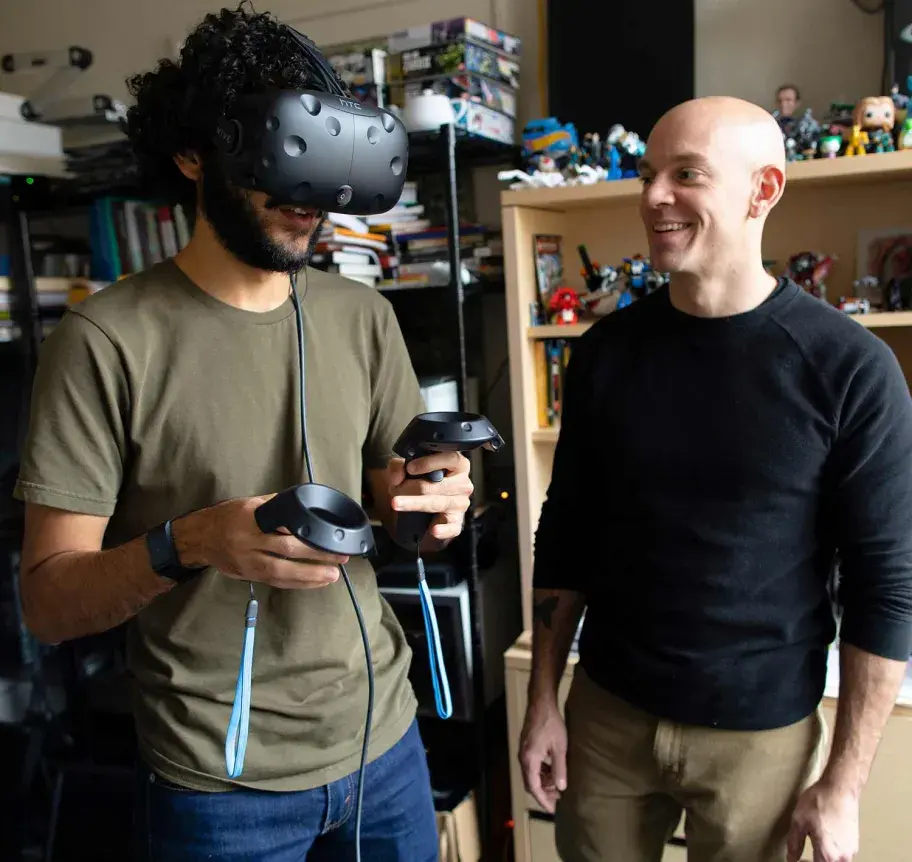 Faculty teaching student about VR