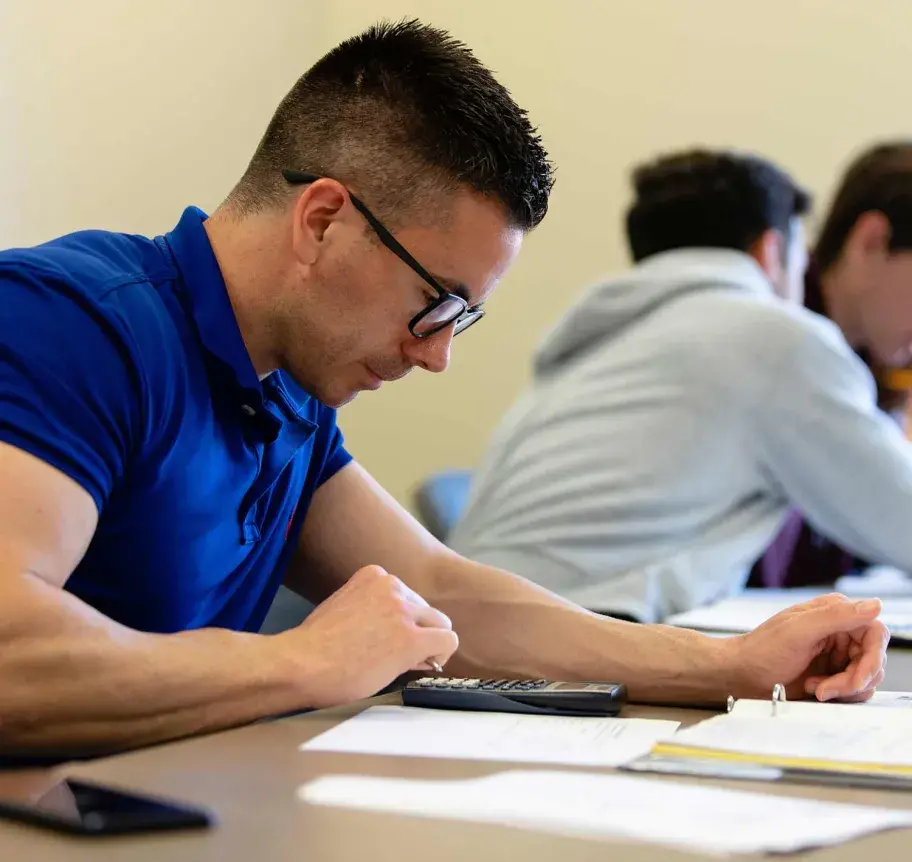 Student in classroom workinng