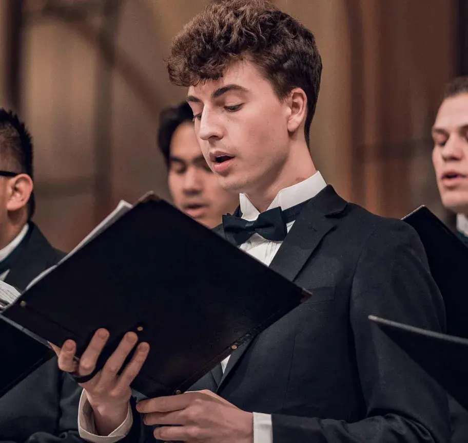 Student singing in choir
