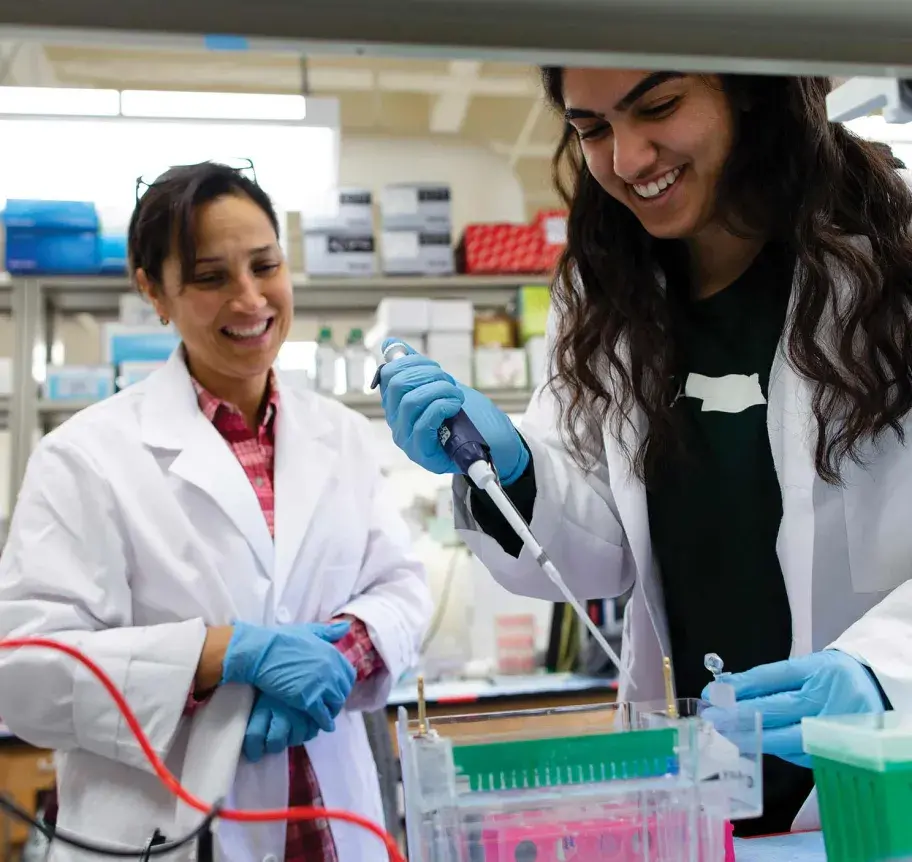 Student and faculty in lab
