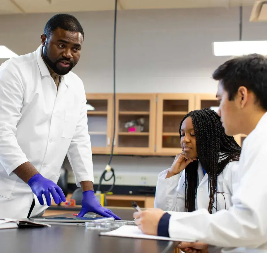 Faculty in discussion with students