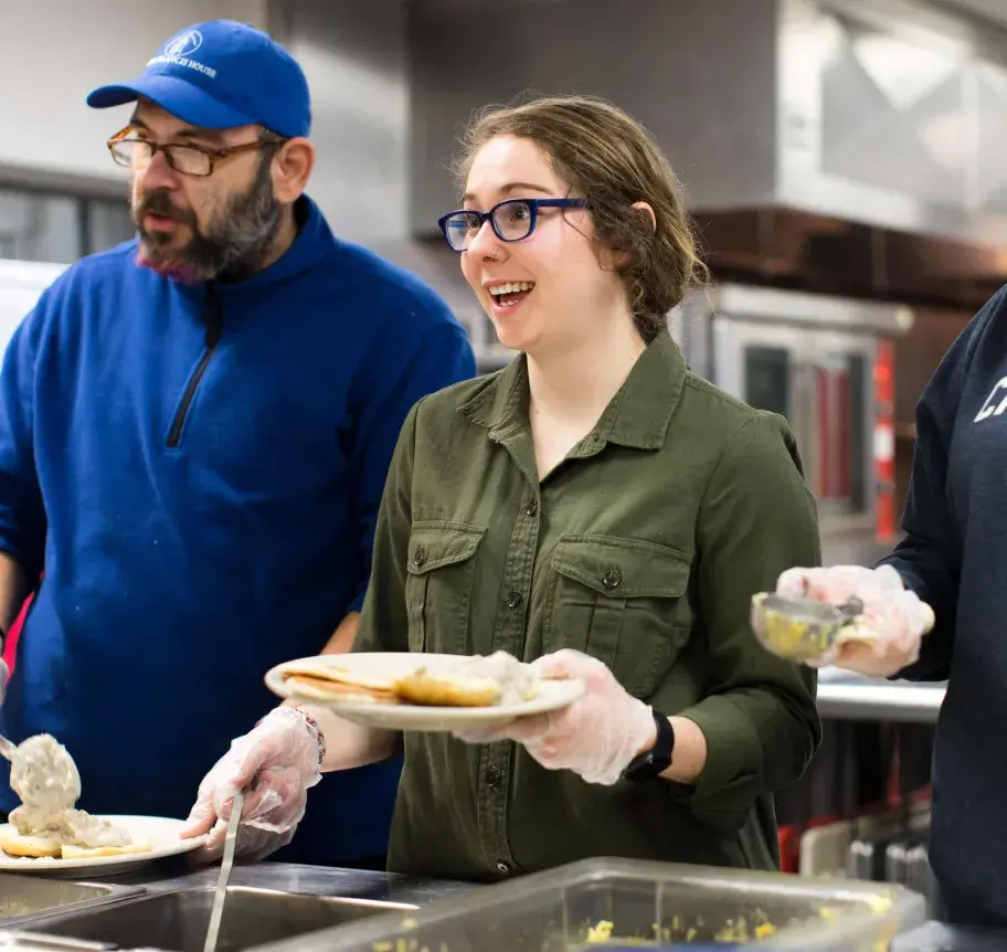 Student serving in community