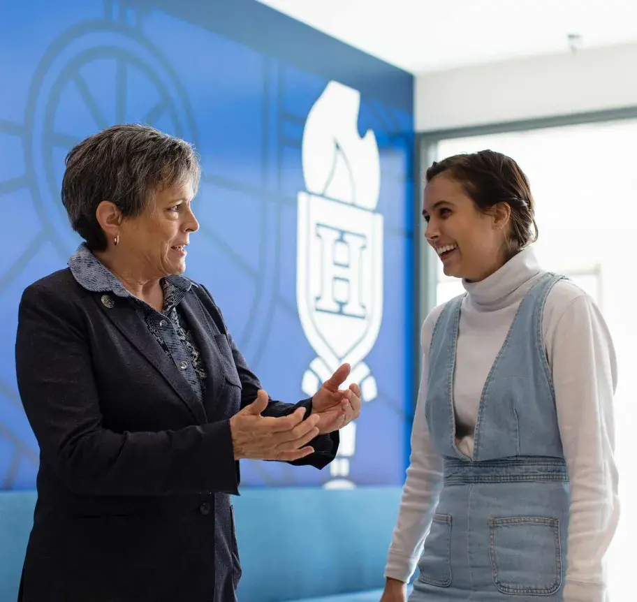Faculty and student in conversation