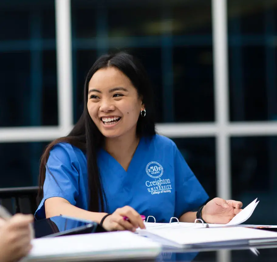 Nursing student smiling while studying