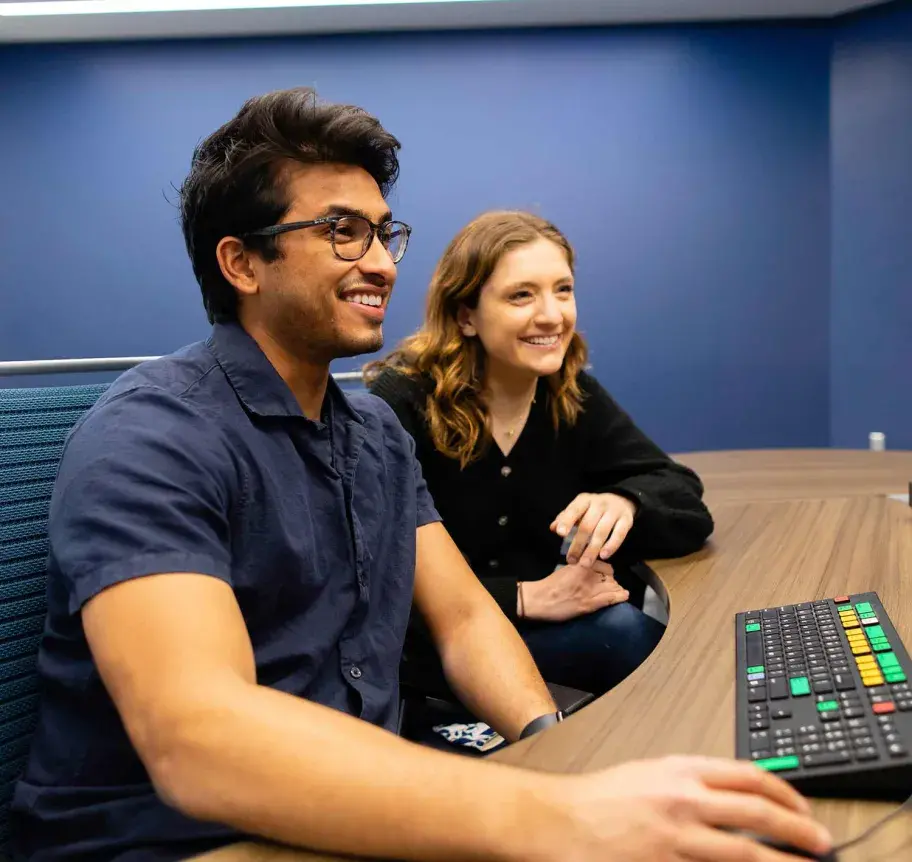 Computer science students working at computer