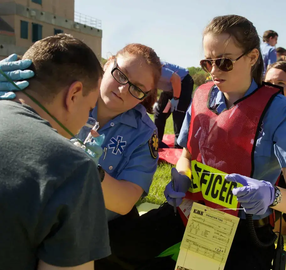 EMS students assessing a patient