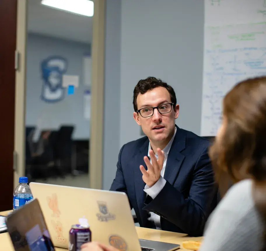 Faculty in discussion with students