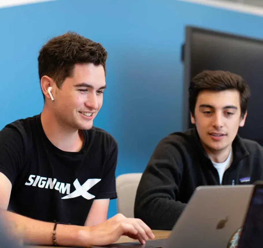 Students working at laptop