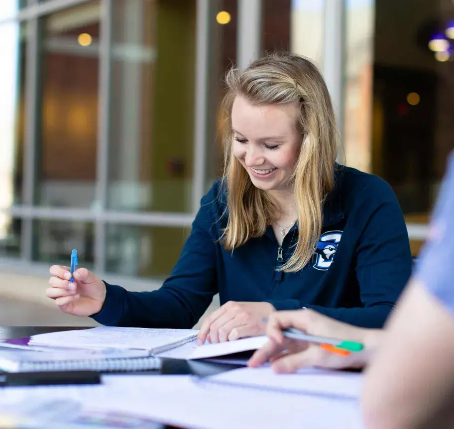 Students studying outdoors on Creighton campus