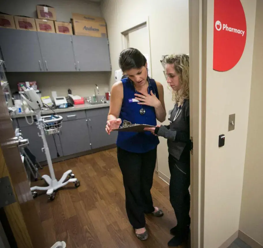 Clinic staff and students in discussion