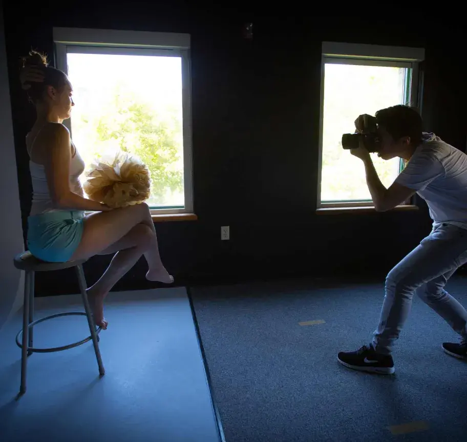Student posing for photography student
