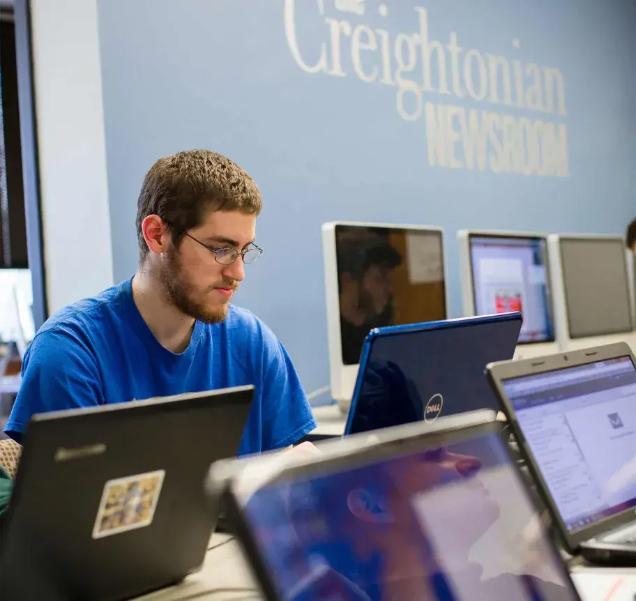 Student working in campus newspaper office