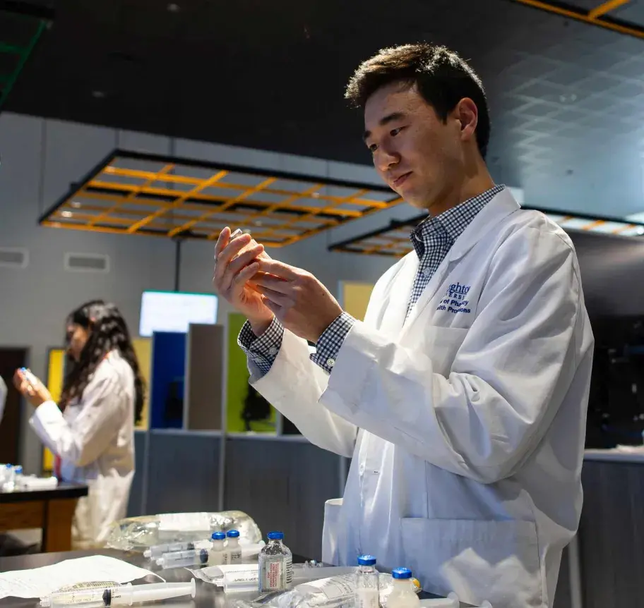 Pharmacy student working with medications
