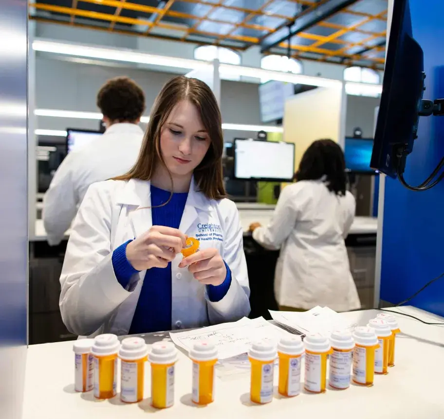 Pharmacy student working with medications
